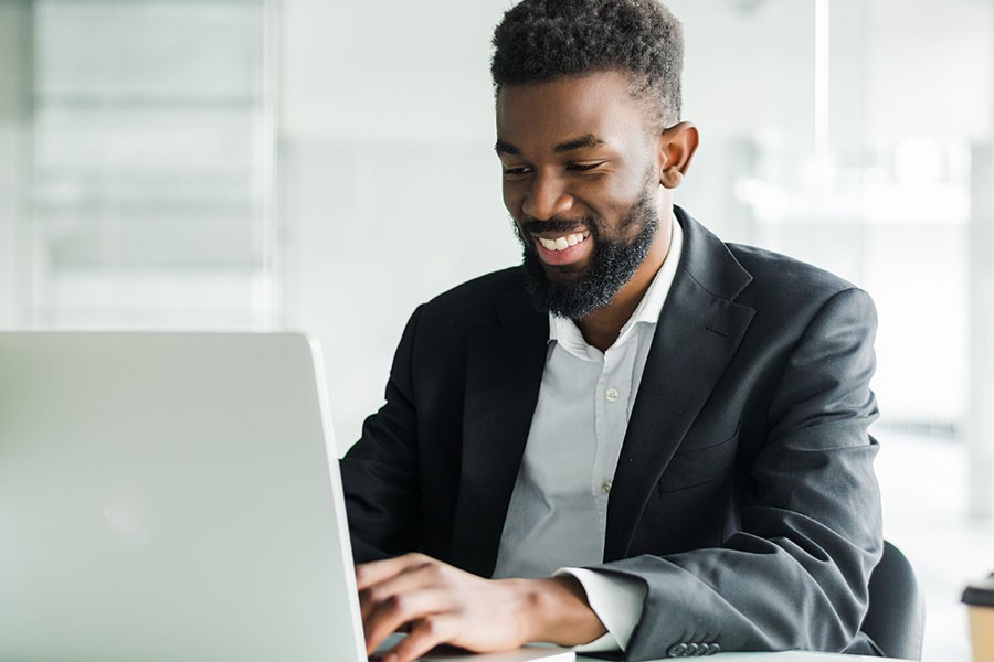 happy-laptop-young-typing-office-thumbnail