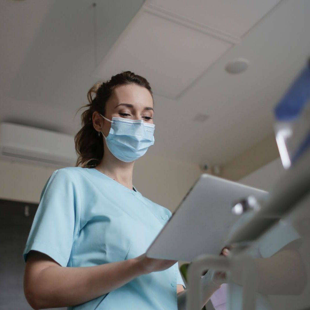 medical professional on tablet
