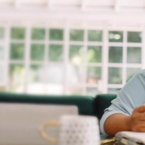 female-smiling-windows-desk