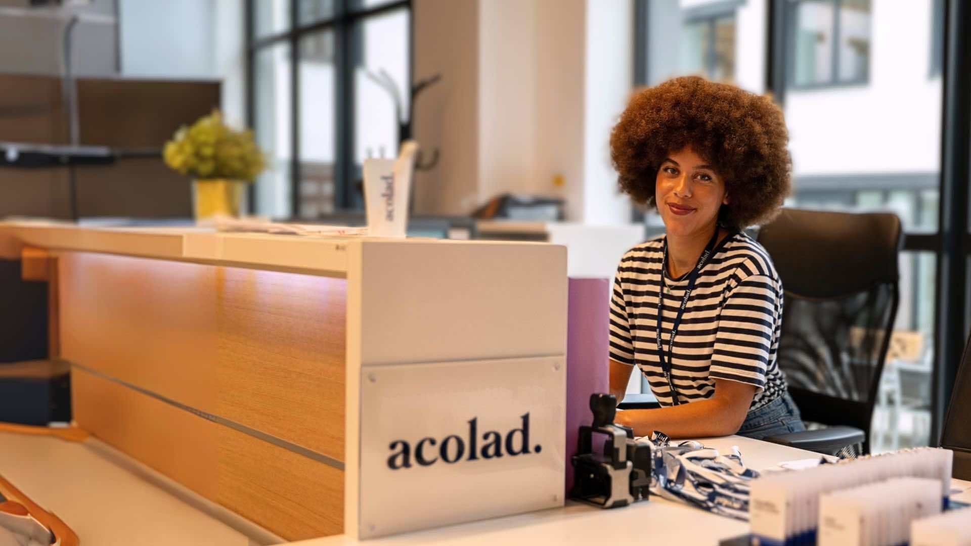 Acolad employee working at the front desk