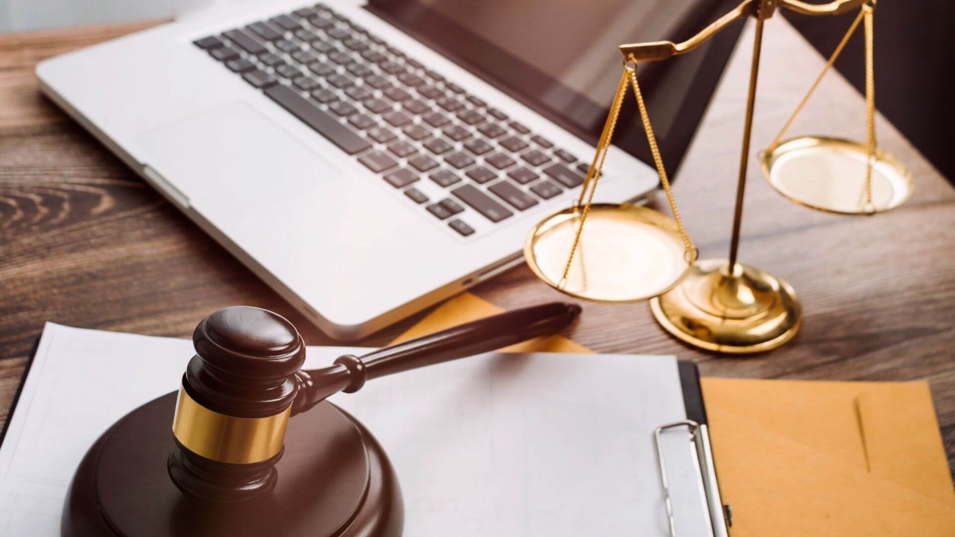 legal gavel, scale and laptop on desk