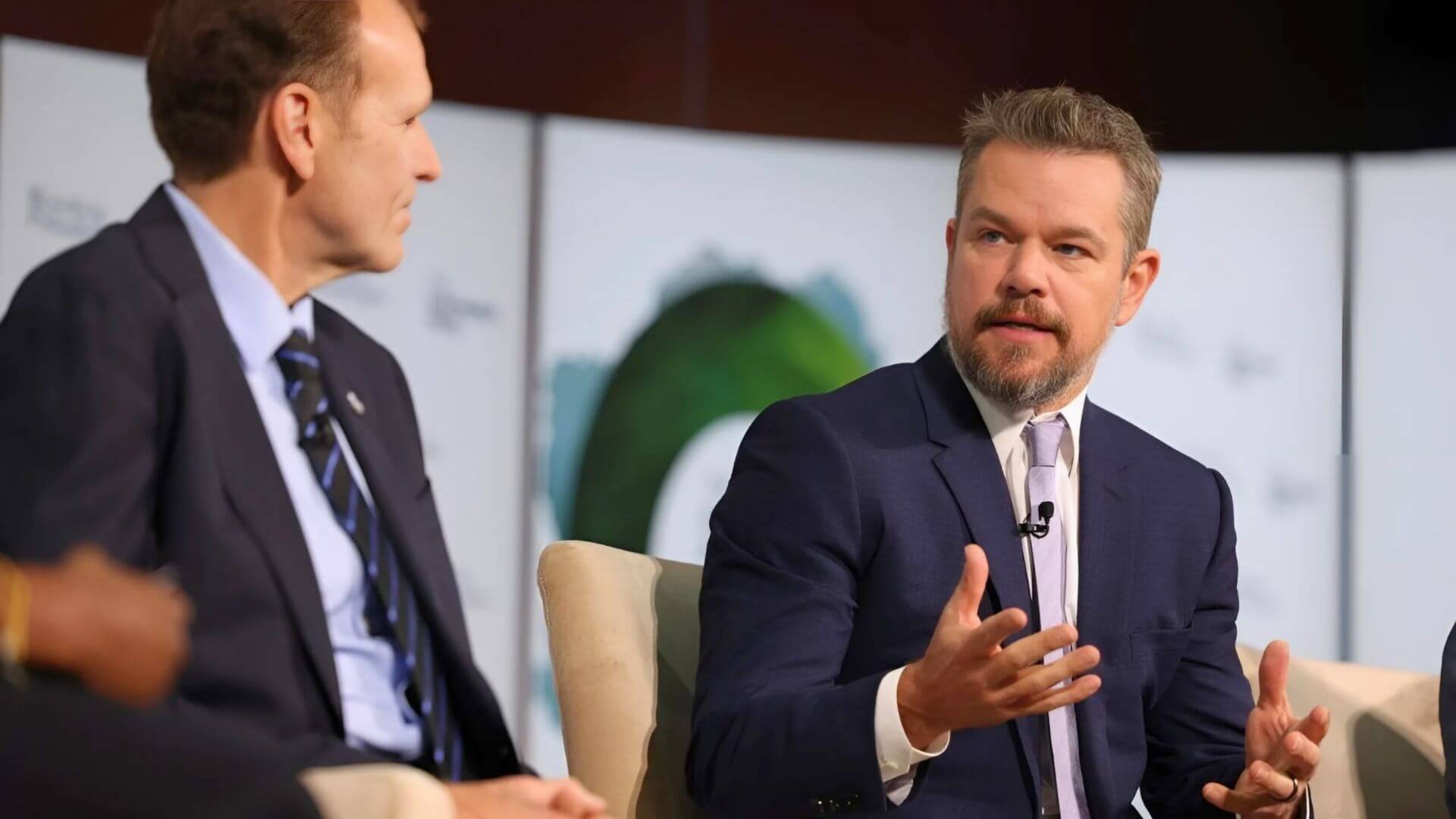 Matt Damon speaking on-stage at event