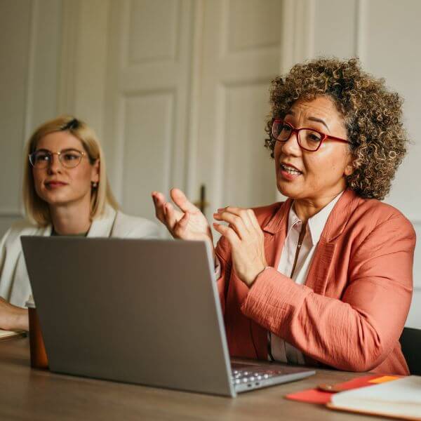 2-woman-meeting-table