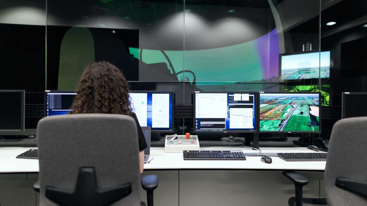 A person sat at the console of a video editing studio