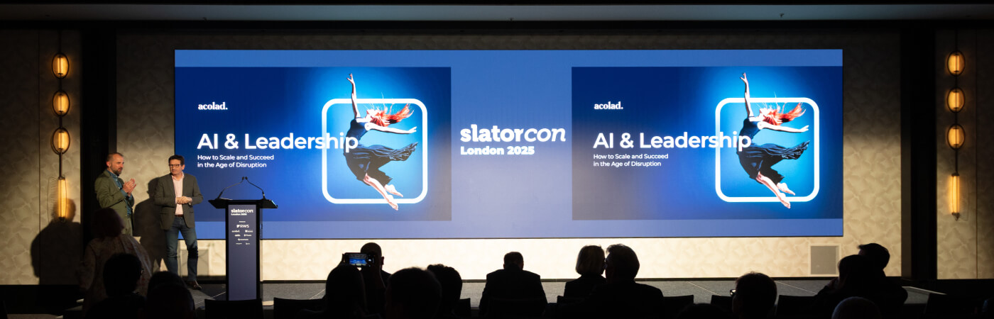 Acolad on stage at Slatorcon presenting on AI & Leadership Acolad on stage at Slatorcon presenting on AI & Leadership