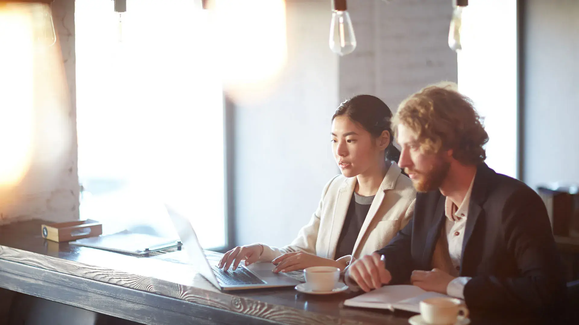 two people working together