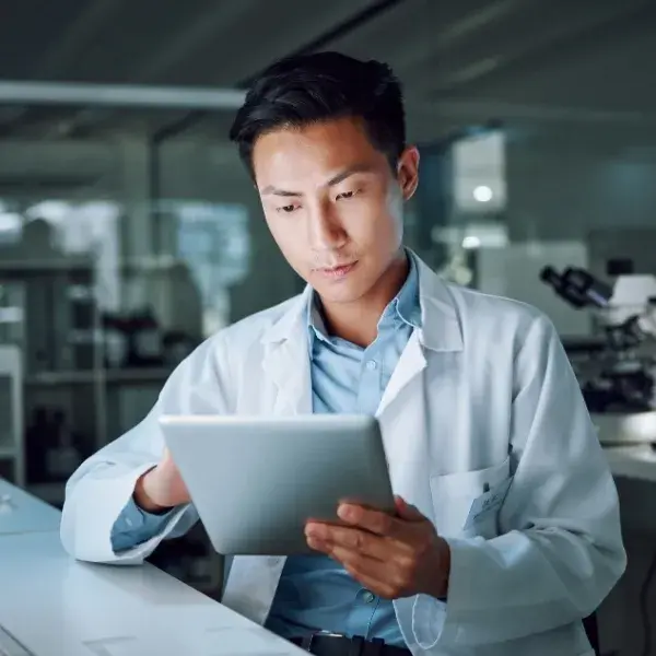 doctor on tablet during clinical research study doctor on tablet during clinical research study