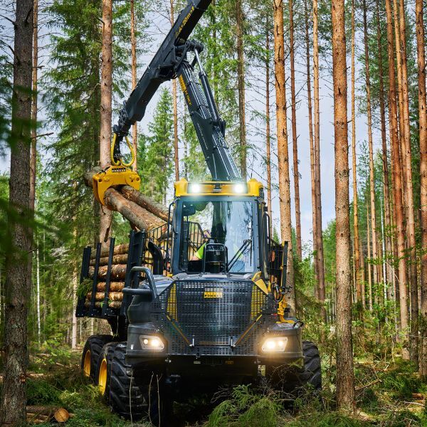 a ponsse machine carrying logs in a forest a ponsse machine carrying logs in a forest