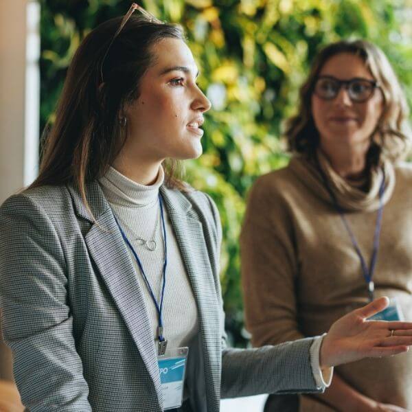 business woman standing in discussion business woman standing in discussion