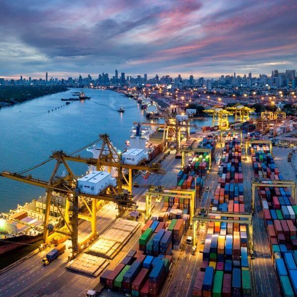 busy shipping port at dusk