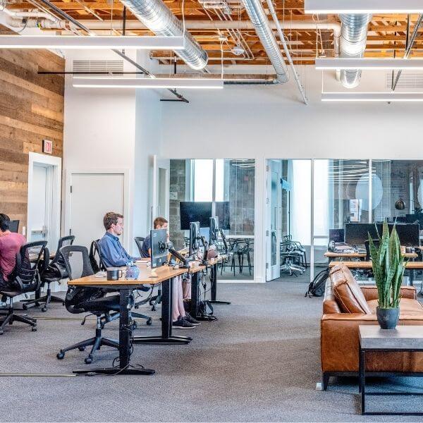 large open office space with people at their workstations