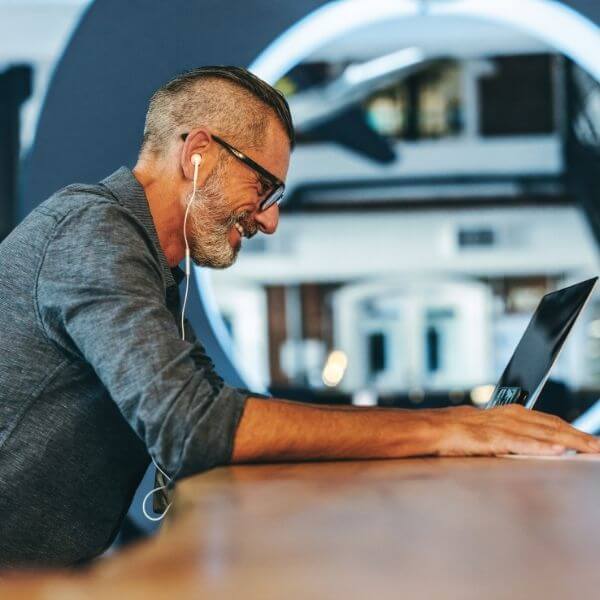 middle aged man working on laptop