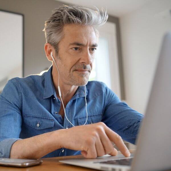 man working on multilingual digital study man working on multilingual digital study