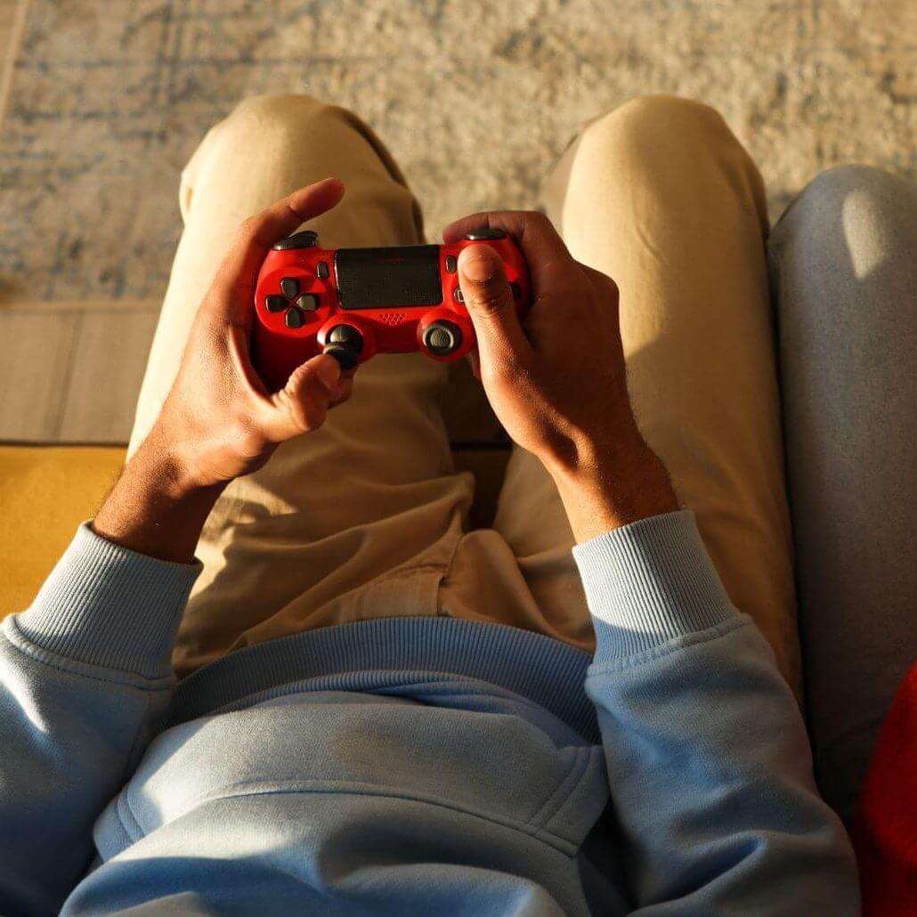 hands holding video game controller hands holding video game controller